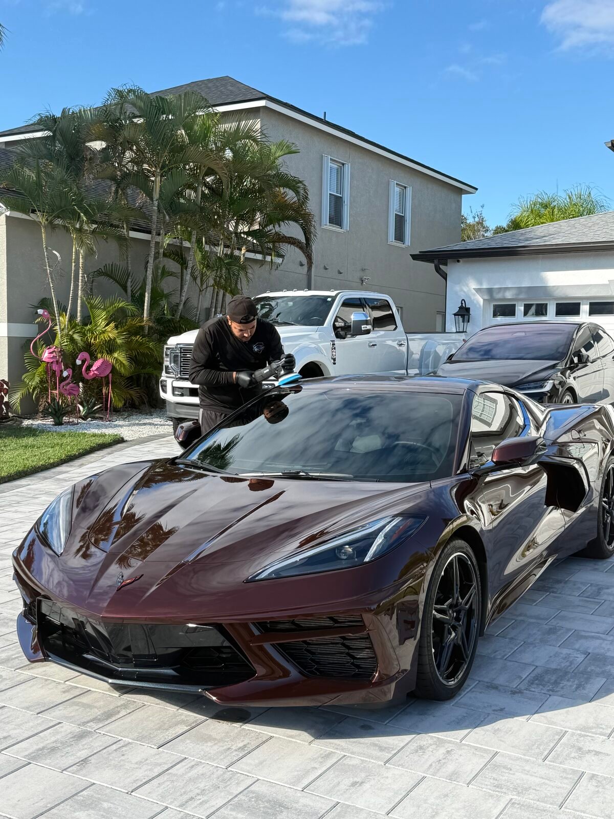 Burgundy Corvette being detailed in a Sarasota driveway